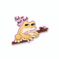 Cartoon character sticker with text 'Eat or Not' on a wooden surface