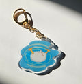 Keychain with a duck butt design on a white background